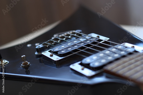 Black arrowed electric guitar close up