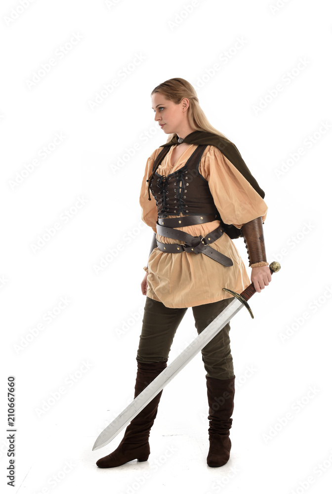 full length portrait of girl wearing brown medieval costume,. standing pose, isolated on white studio background. full length portrait of girl wearing brown medieval costume,. standing pose, isolated on white studio background.