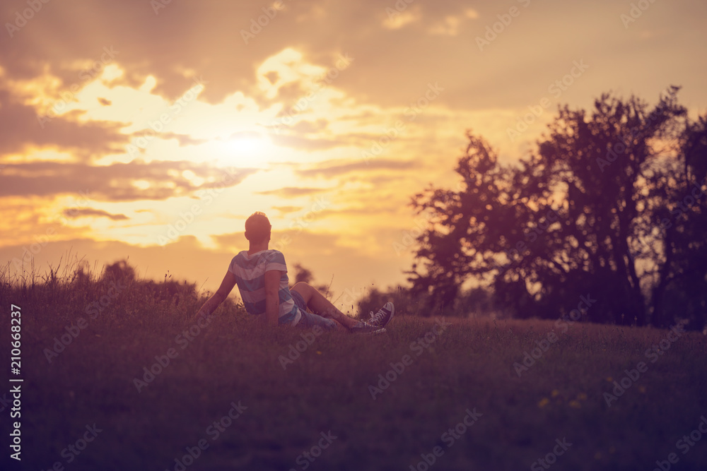 Man enjoying in nature at sunset time.