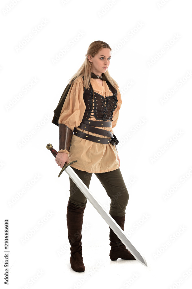 full length portrait of girl wearing brown medieval costume,. standing pose, isolated on white studio background. full length portrait of girl wearing brown medieval costume,. standing pose, isolated on white studio background.