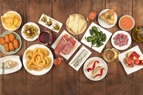 Spanish tapas food on dark background with place for text