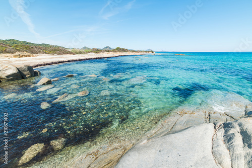 Rocks and blue sea in Sant Elmo beach photo