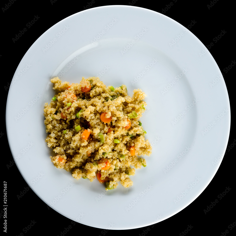 Delicious pilaf with vegetables and herbs in a white plate isola Delicious pilaf with vegetables and herbs in a white plate isola
