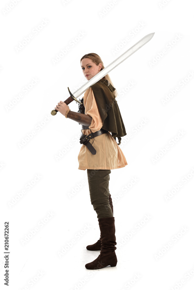 full length portrait of girl wearing brown medieval costume,. standing pose, isolated on white studio background. full length portrait of girl wearing brown medieval costume,. standing pose, isolated on white studio background.