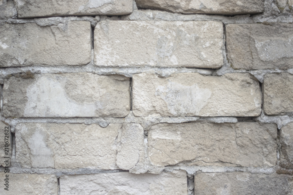 An old weathered brick wall with grungy texture An old weathered brick wall with grungy texture