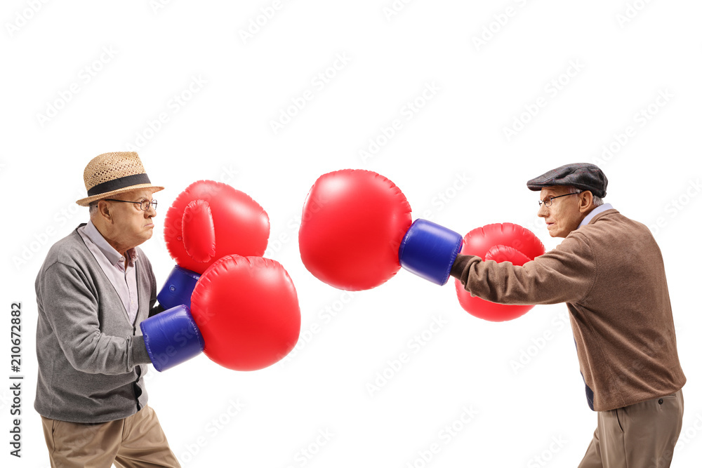 Seniors fighting each other with big boxing gloves Photos Adobe