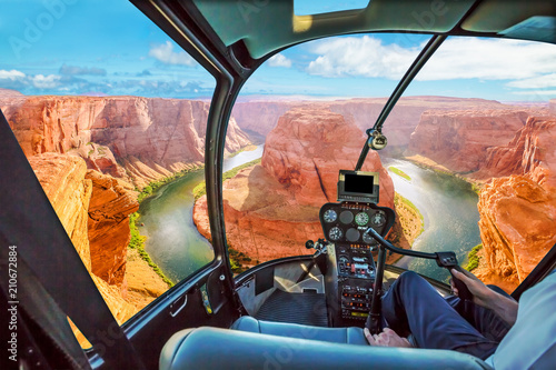 Helicopter cockpit scenic flight over Horseshoe Bend of Colorado River in Arizona, United States. Downstream from the Glen Canyon Dam and Lake Powell.