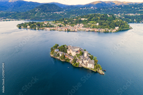 The very suggestive and romantic island of San Giulio in Orta lake, Piedmont, Italy. Aerial view.