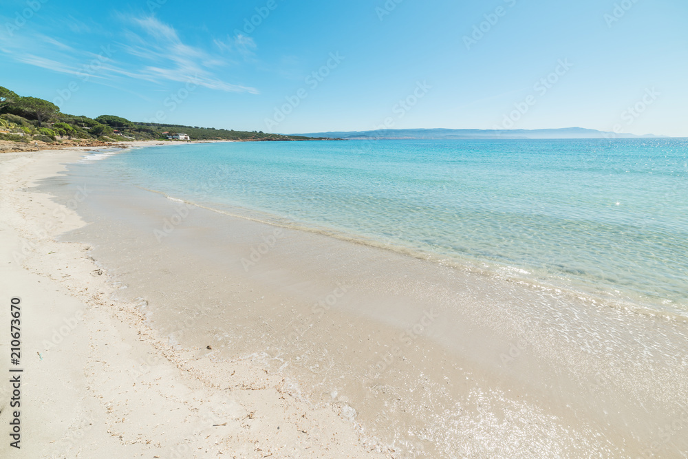 Turquoise water in Le Bombarde beach in Alghero