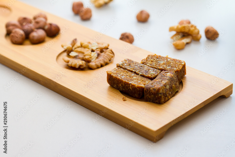 Nuts and Date Palm in Wooden Plate