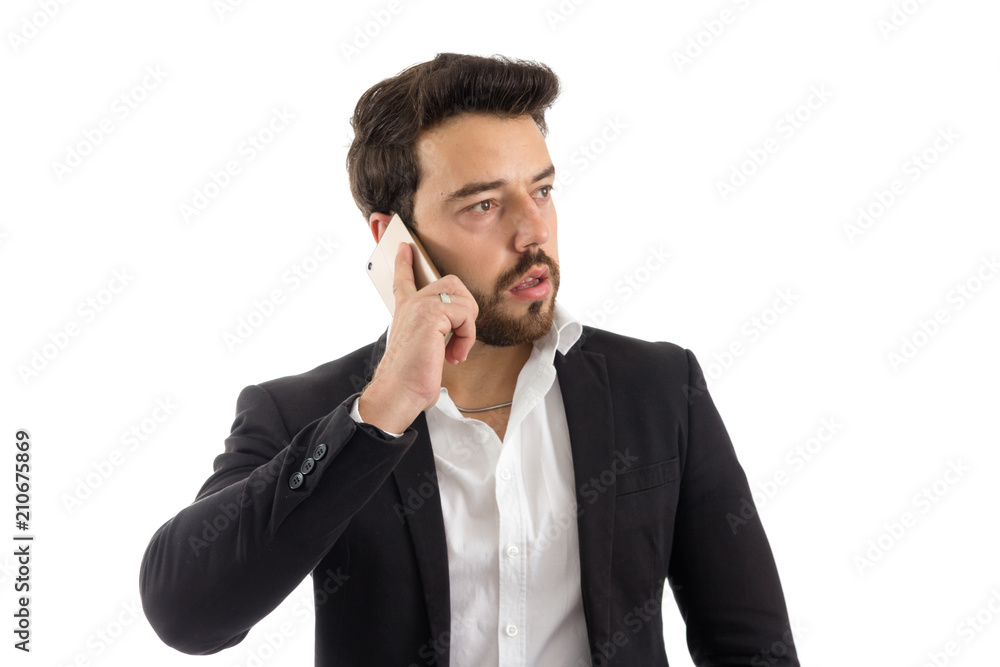 Elegant man is talking on the phone. bearded person wears black jacket and white shirt. Isolated.. Elegant man is talking on the phone. bearded person wears black jacket and white shirt. Isolated..
