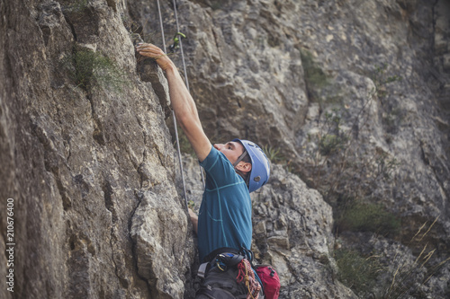 A Man Climbing a Mountain © LStockStudio