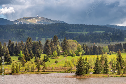 French landscape - Jura. View over the lake of Les Rousses in the Jura mountains (France) with the Mount La Dole (Switzerland) in the background. photo