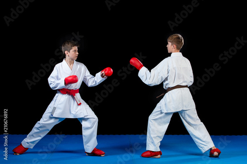 The studio shot of group of kids training karate martial arts