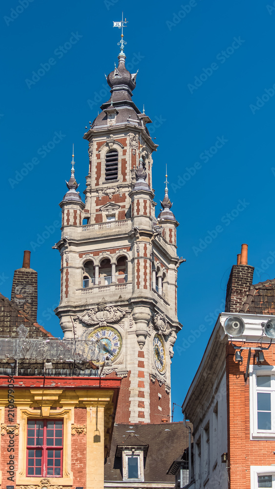 Lille, old facades in the center, the belfry of the Chambre de Commerce in background 
