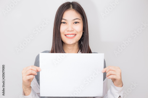 Beautiful asian women hold white blank paper advertising