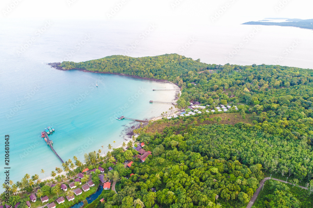 Aerial sea view of beautiful curve beach with wooden pier