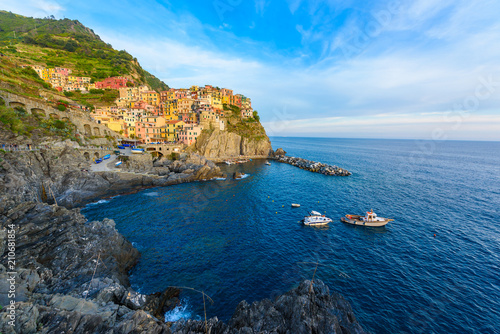 Manarola - Village of Cinque Terre National Park at Coast of Italy. Beautiful colors at sunset. Province of La Spezia, Liguria, in the north of Italy - Travel destination and attractions in Europe.