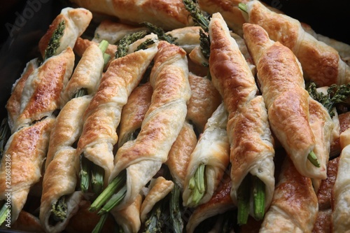 green sprouts of asparagus in dough