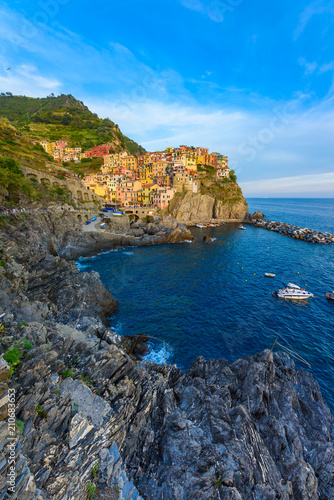 Manarola - Village of Cinque Terre National Park at Coast of Italy. Beautiful colors at sunset. Province of La Spezia  Liguria  in the north of Italy - Travel destination and attractions in Europe.