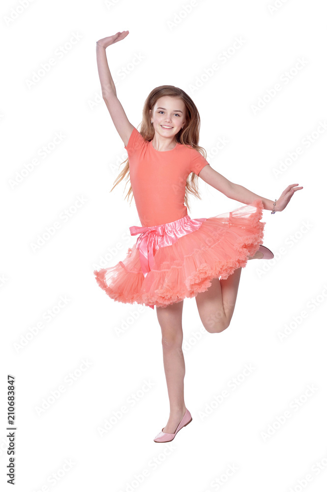 Naklejka premium Happy little girl in dress posing