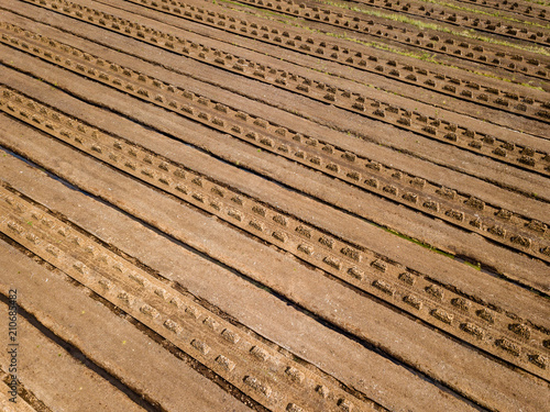 drone image. aerial view of rural area with fields of turf development © Martins Vanags