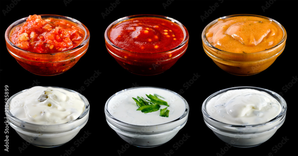 Set of different delicious sauces for dishes isolated on black b Set of different delicious sauces for dishes isolated on black b