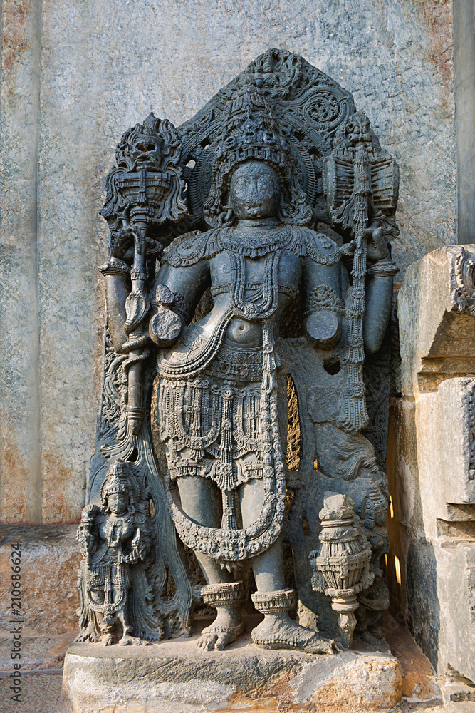 Close up of dwarapala on the right side of the North entrance, Hoysaleshvara Temple, Halebid, Karnataka