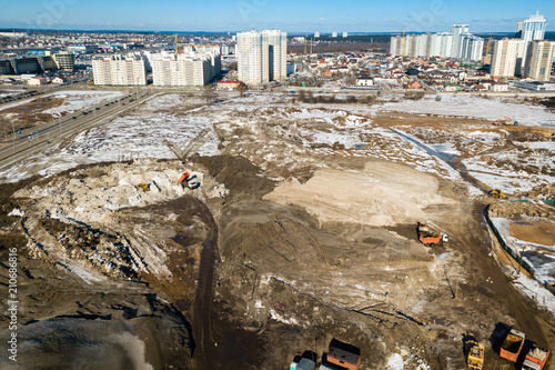 Industrial earthworks loader bucket machines on building constru photo