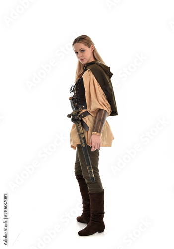 full length portrait of girl wearing brown medieval costume,. standing pose, isolated on white studio background.