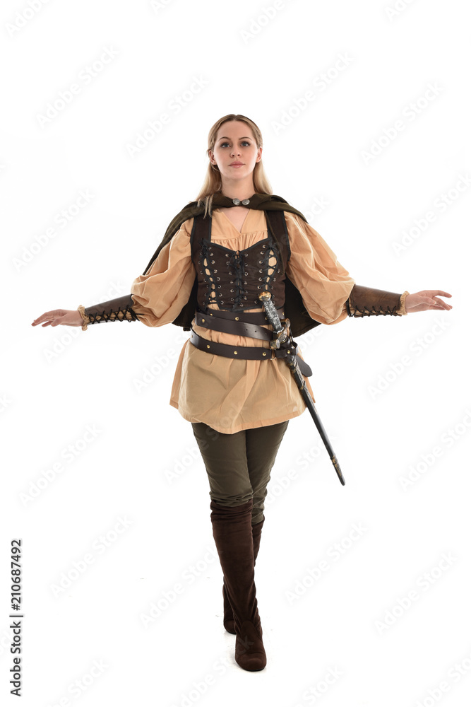 full length portrait of girl wearing brown medieval costume,. standing pose, isolated on white studio background. full length portrait of girl wearing brown medieval costume,. standing pose, isolated on white studio background.