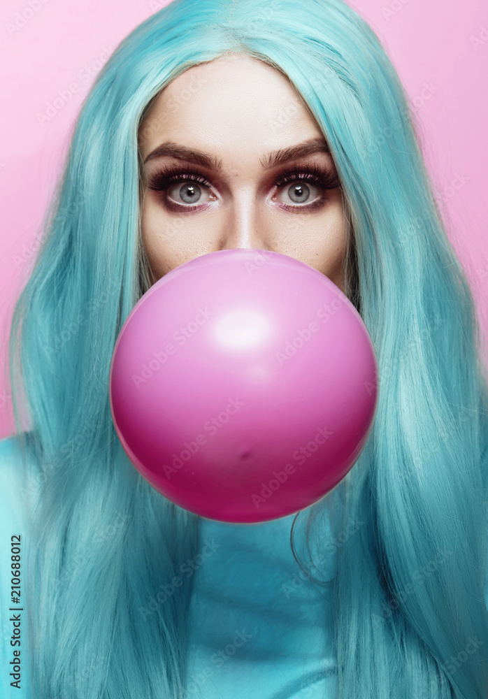 Beautiful young woman face close up, blowing a balloon Stock Photo ...