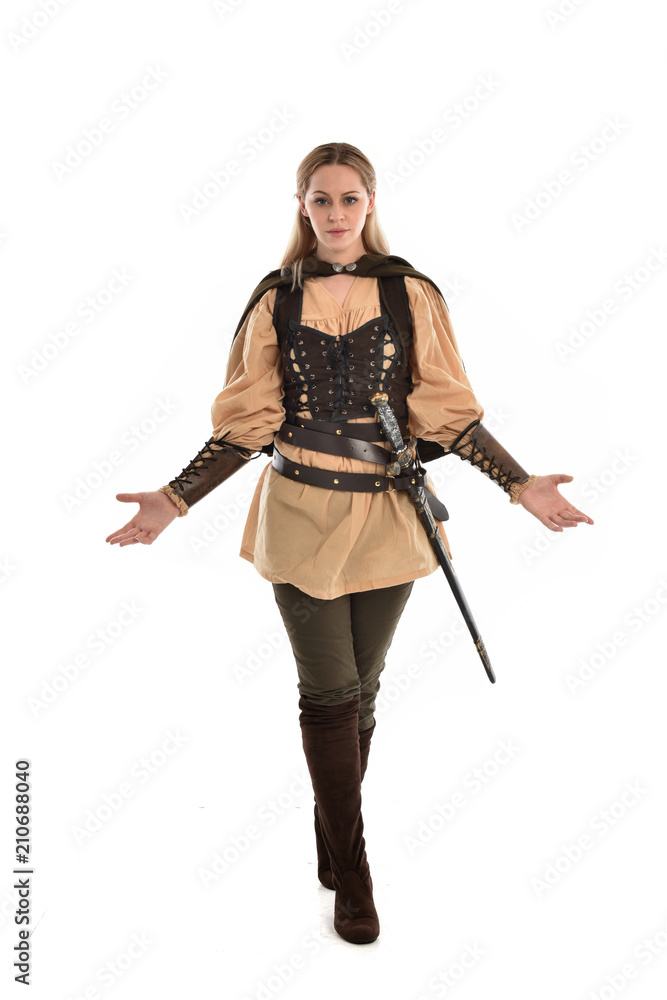 full length portrait of girl wearing brown medieval costume,. standing pose, isolated on white studio background. full length portrait of girl wearing brown medieval costume,. standing pose, isolated on white studio background.