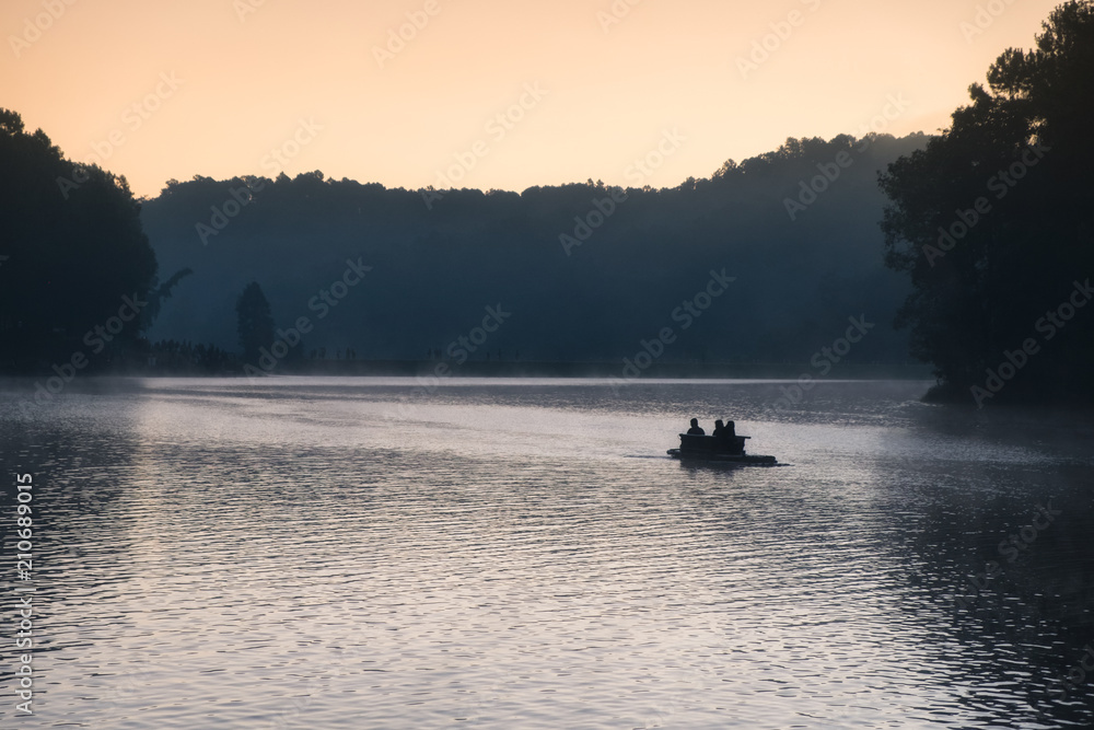 Tourist wood rafting on fog reservoir