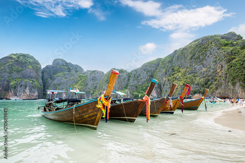 Wooden long-tail boats anchored on seashore at Maya bay