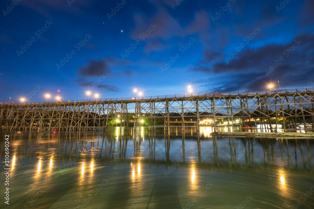 Famous wooden mon bridge in sangkhlaburi at twilight