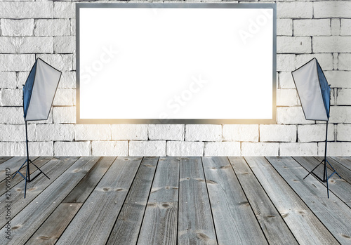 Blank billboard with with studio lights on wooden floor on wall