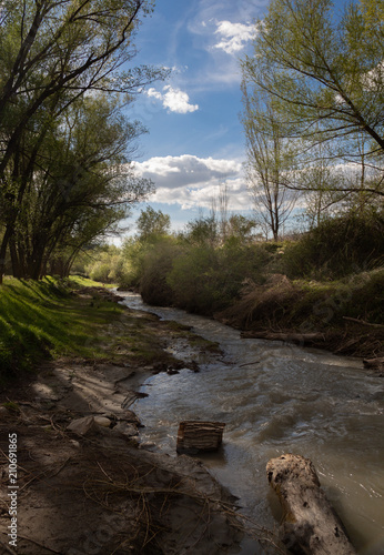 Granada, Spain; April 14, 2018: Landscape view of the Genil River as it passes through Cenes photo