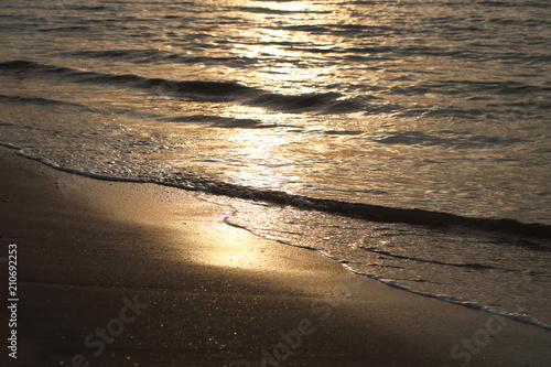sunlight reflect on wave sea water when sunrise at coast, felling tranquil