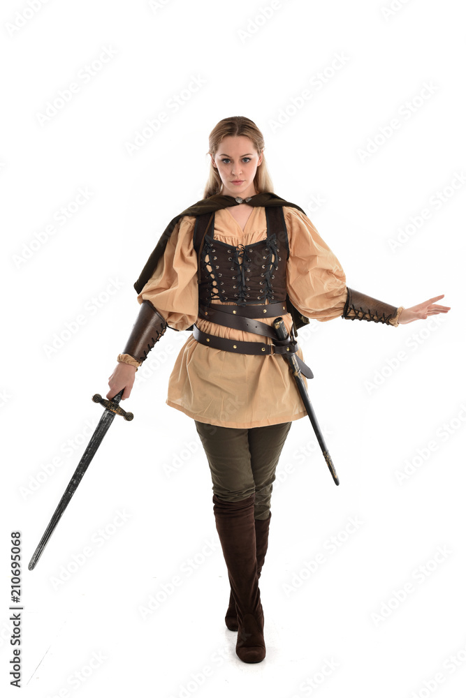full length portrait of girl wearing brown medieval costume,. standing pose, isolated on white studio background. full length portrait of girl wearing brown medieval costume,. standing pose, isolated on white studio background.