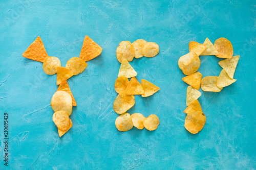 word yep chips blue background junk food eating photo