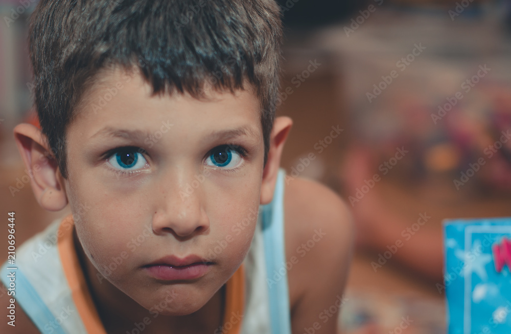 Portrait of kid with blue eyes and with intense stare Portrait of kid with blue eyes and with intense stare