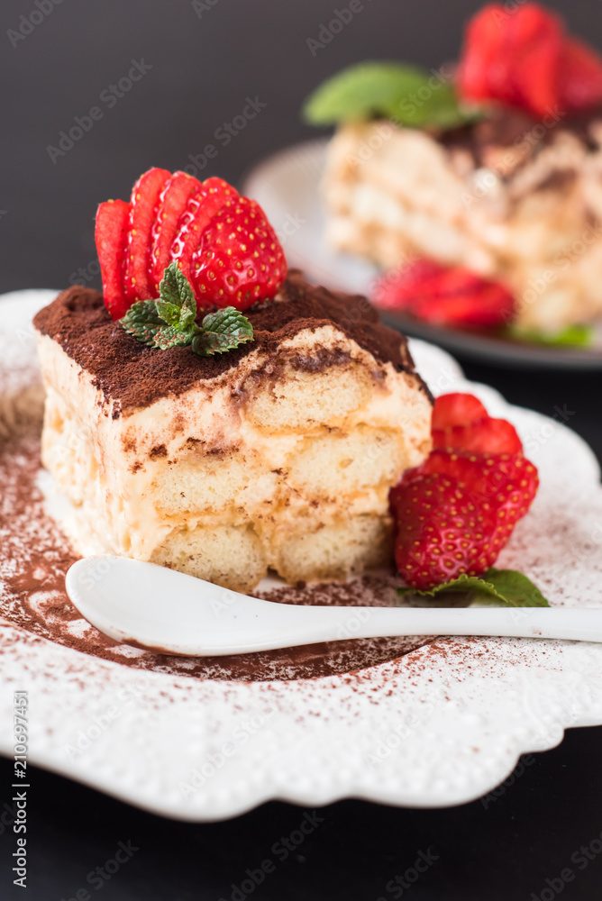 Strawberry tiramisu on a white porcelain plate