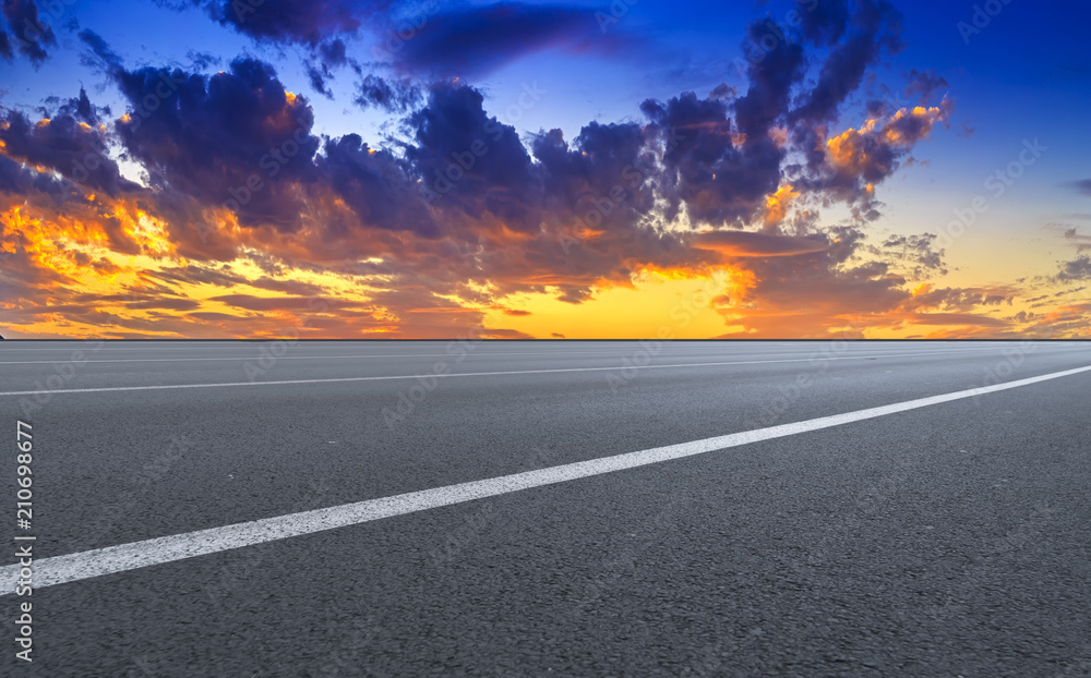 Fototapeta premium Empty highway asphalt road and beautiful sky sunset landscape