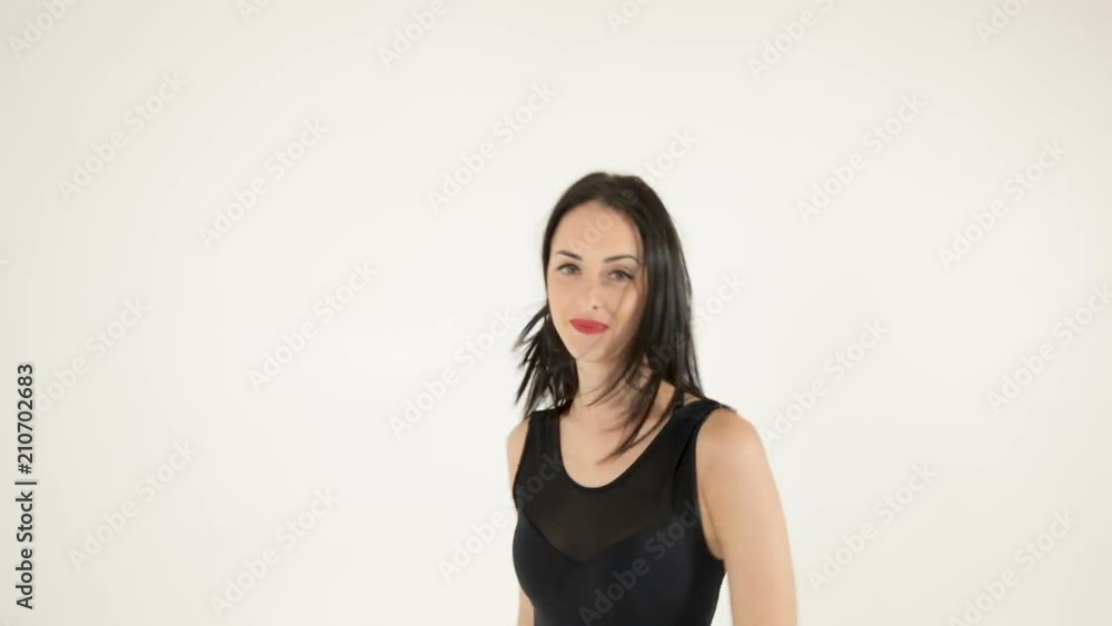 attractive woman dancing and looking at camera attractive woman dancing and looking at camera