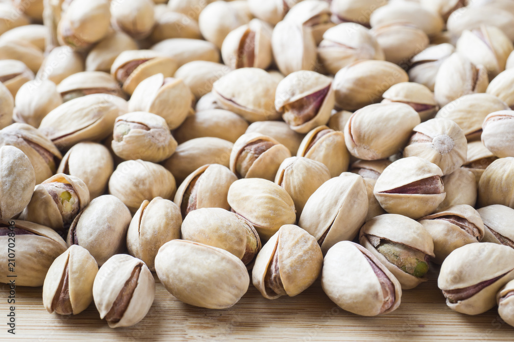 Salty pistachios nuts Background of the full population Salty pistachios nuts Background of the full population