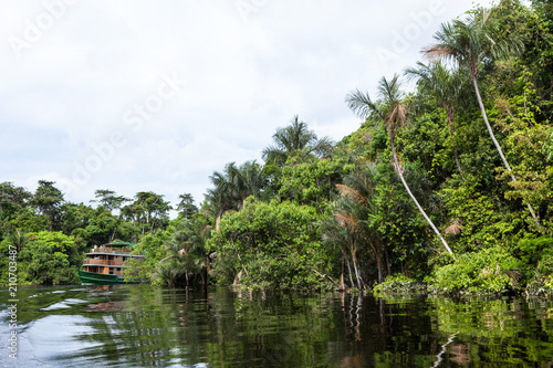 Amazonas, Brazil. A traditional wooden boat on an affluent river of the Negro River in the Amazon.