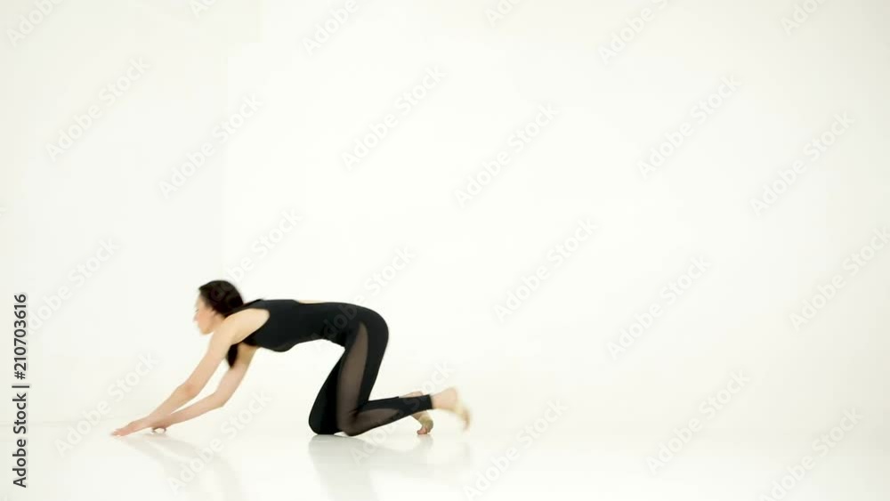 gymnast doing horizontal twine in the air gymnast doing horizontal twine in the air