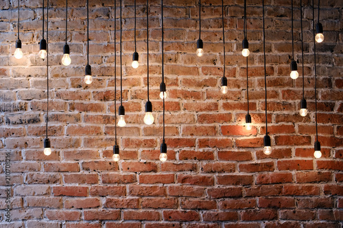 Fototapeta Old brick wall with bulb lights lamp