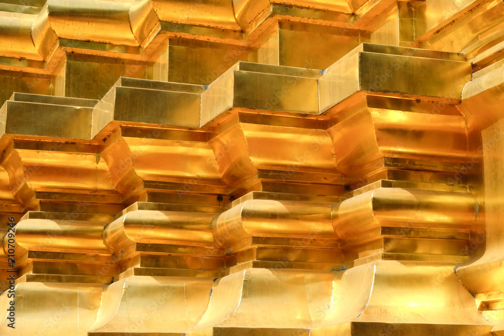 The gold stucco design of native thai style on the Wall The gold stucco design of native thai style on the Wall
